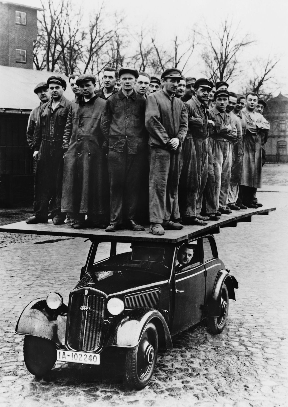 30 Audi Workers Demonstrating The Strength of Their Car in 1937 7 HI990034 full